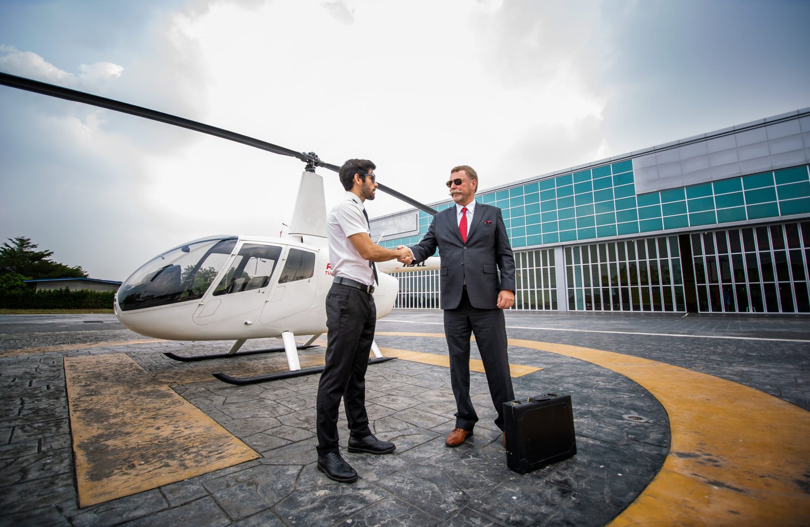 close-up-male-helicopter-pilot-wear-sun-glass-business-people-executive-ceo-standing-against-helicopter-aircraft-landing-point-airport-bright-sunny-day